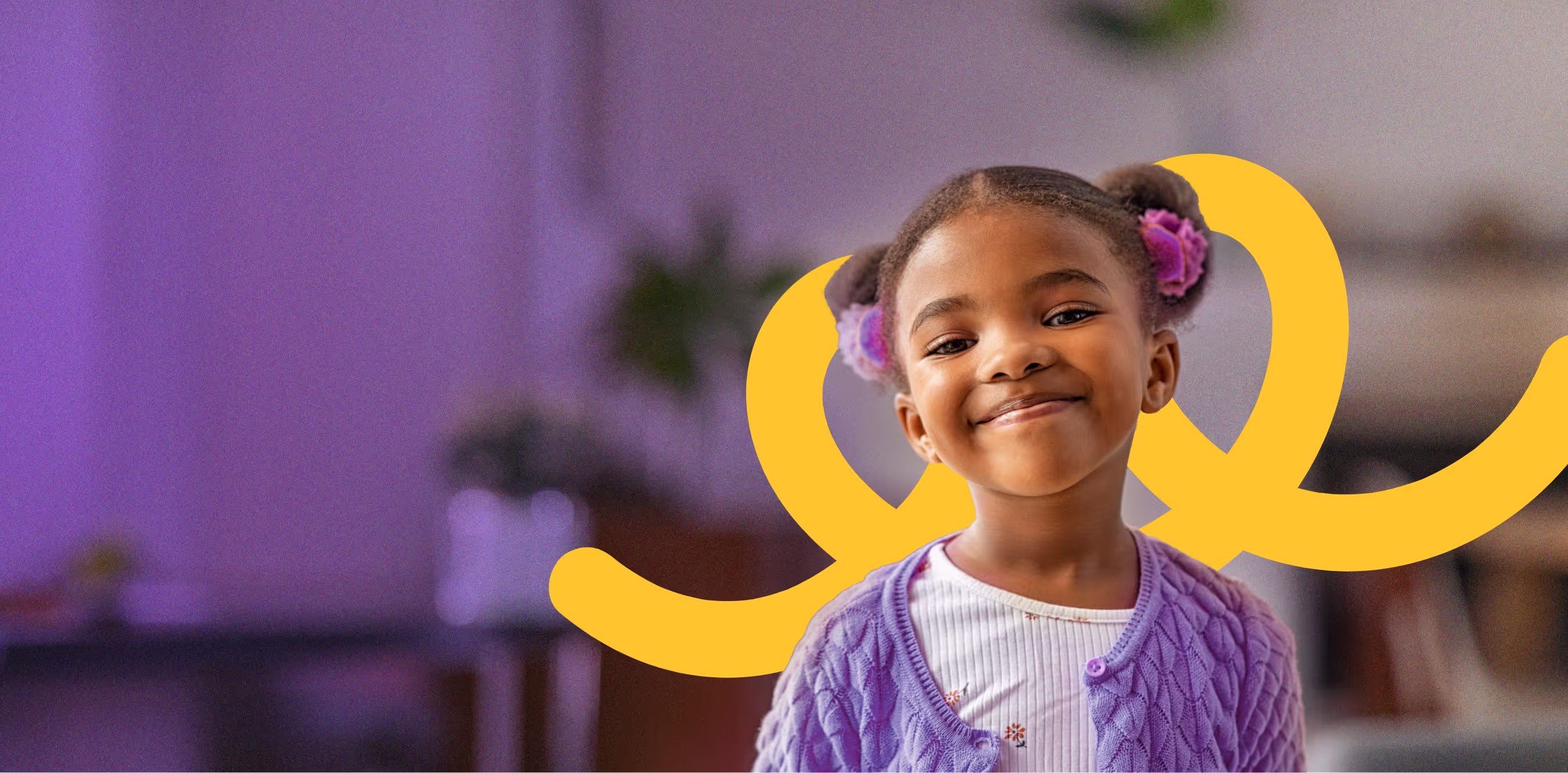 A smiling child in purple, from Playto’s official homepage